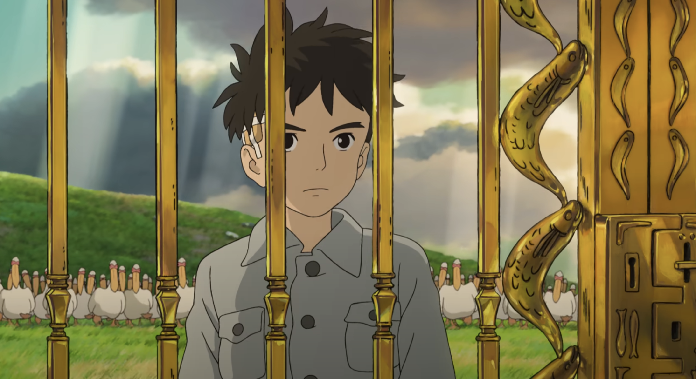 Animated character Mahito Maki looking solemn while standing near a fence with creatures in the background