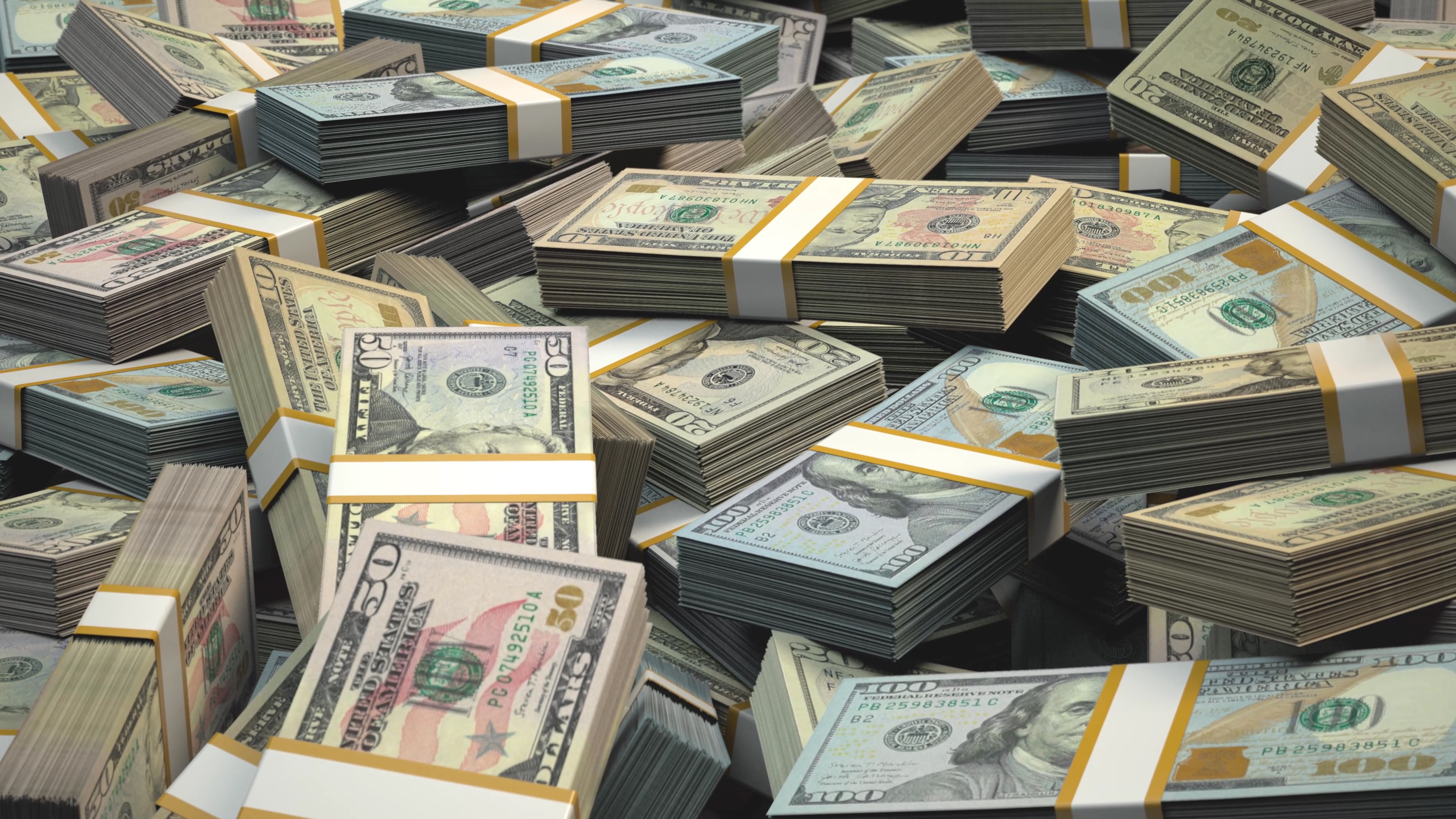 Stacks of various US dollar bills in disarray