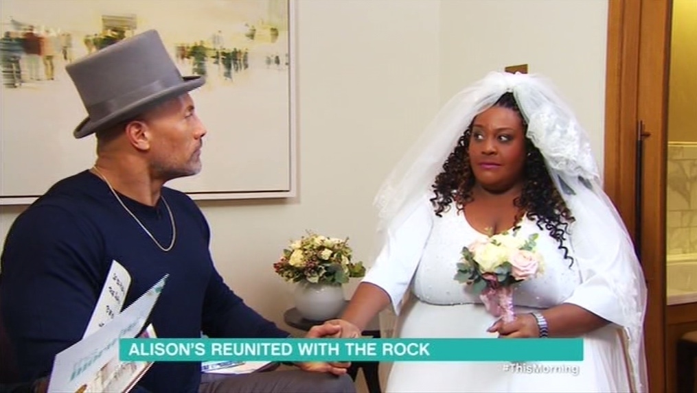 A man and Alison, both in wedding attire, appear in a TV show segment titled &quot;ALISON&#x27;S REUNITED WITH THE ROCK.&quot;