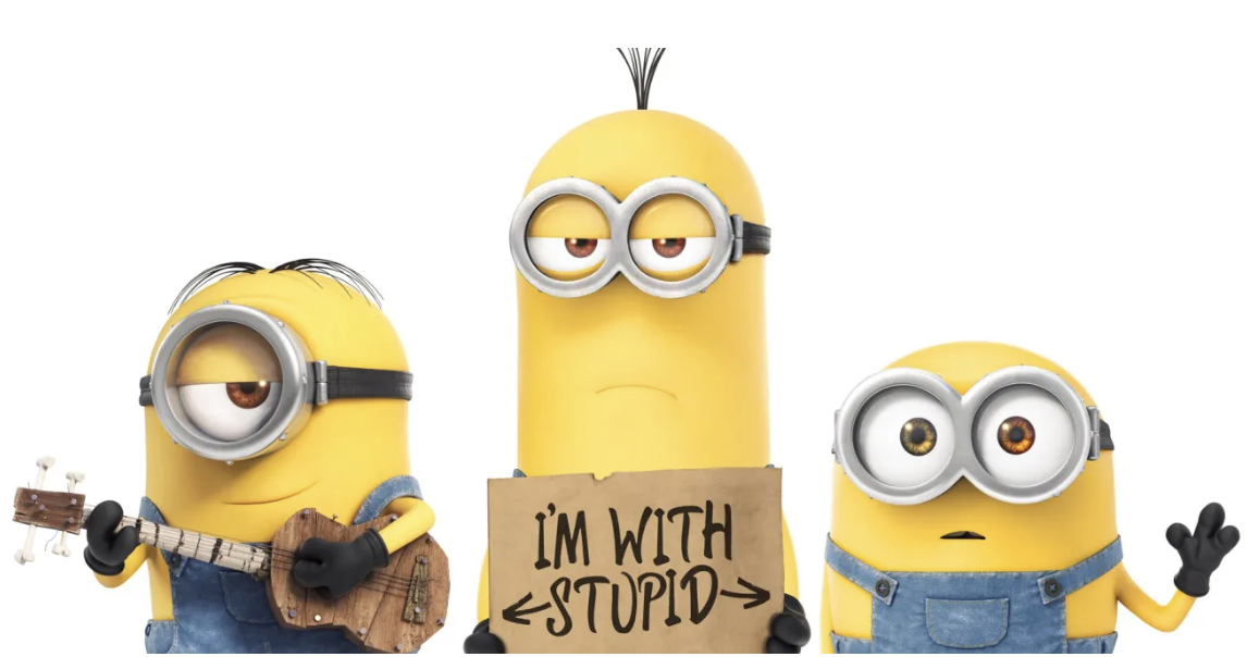 Three Minions, one with a guitar and sign reading &quot;I&#x27;m with stupid&quot; pointing to the center Minion