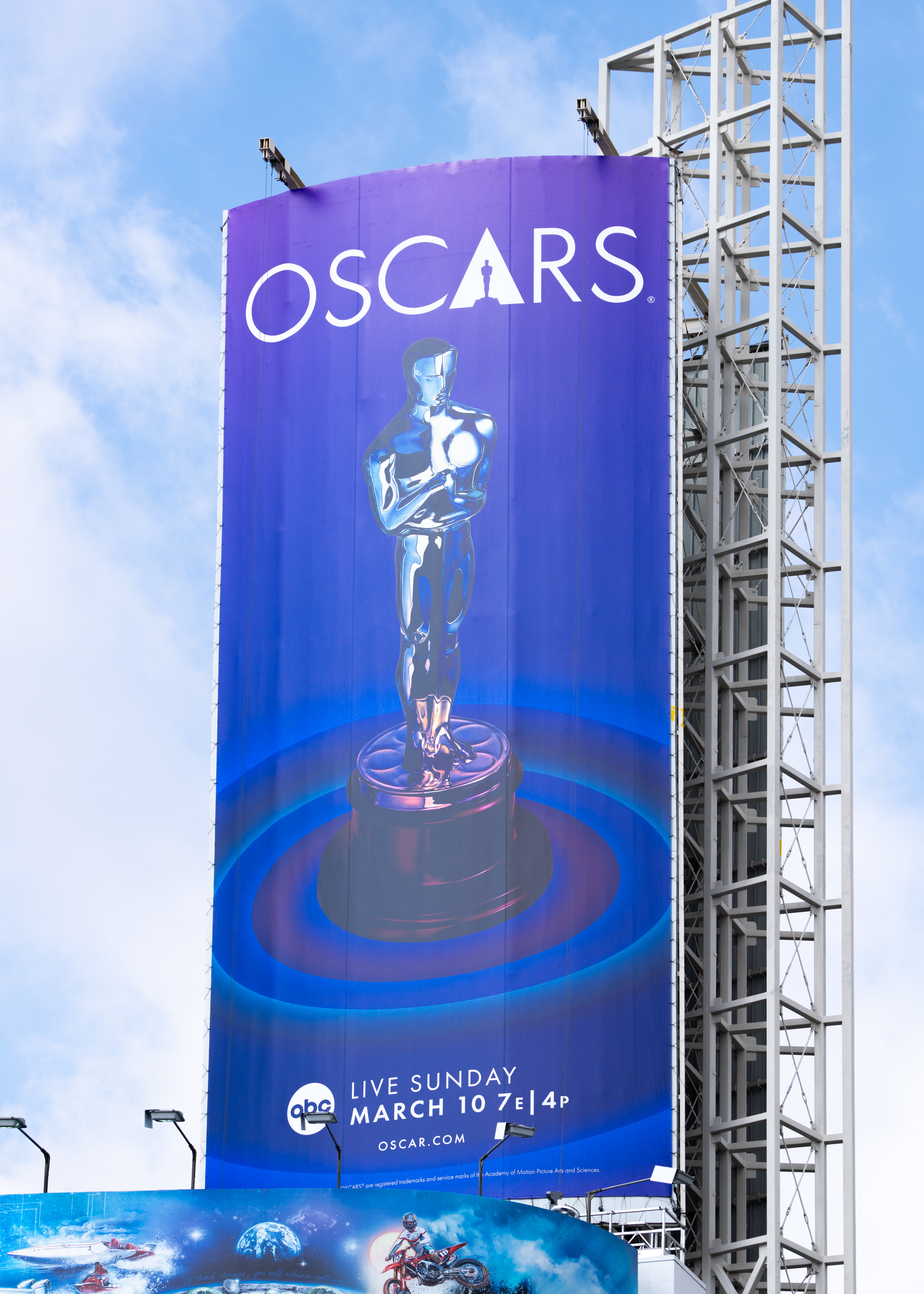 Oscars advertisement banner featuring the iconic statuette, date, and broadcast information: &quot;Live Sunday March 10 7E/4P&quot;