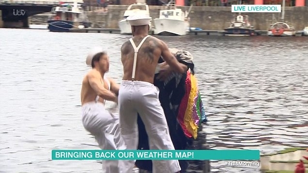 Two people attempt a daring cold water plunge on live TV, with one person wearing a colorful outfit