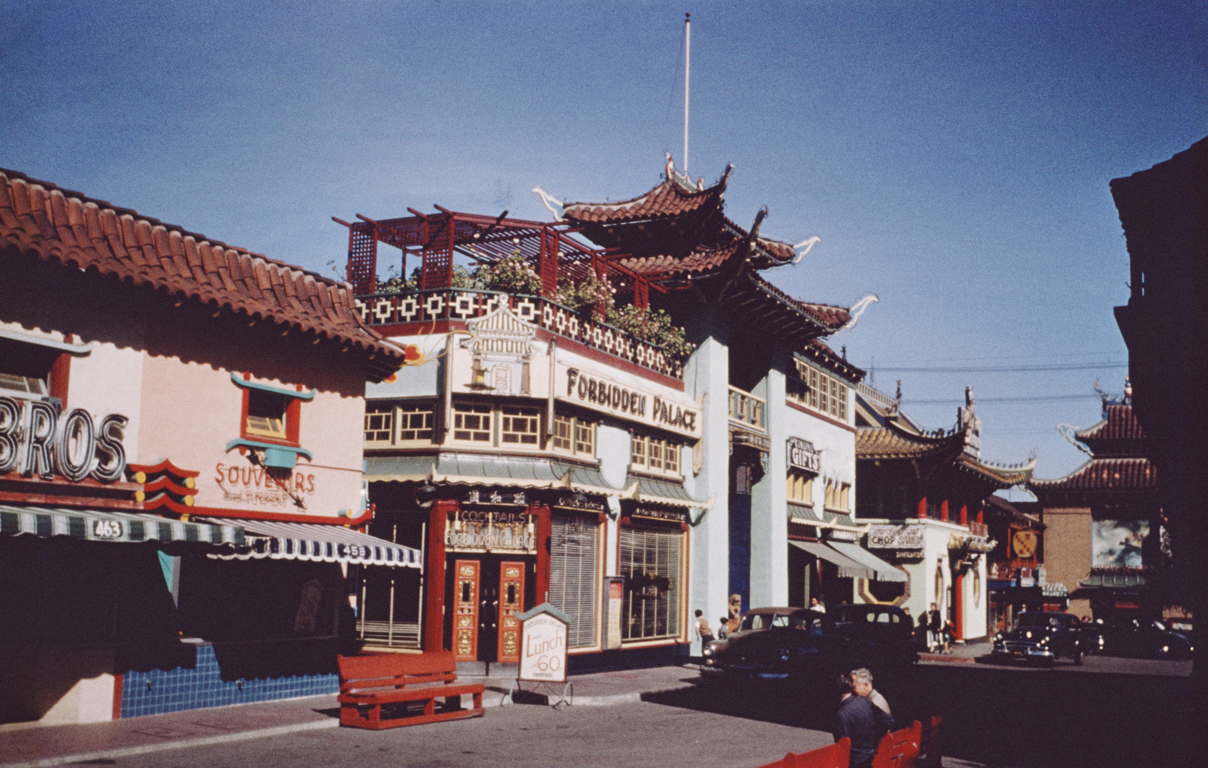 Traditional Chinese-style architecture with &quot;Forbidden Palace&quot; signage and adjacent souvenir shop