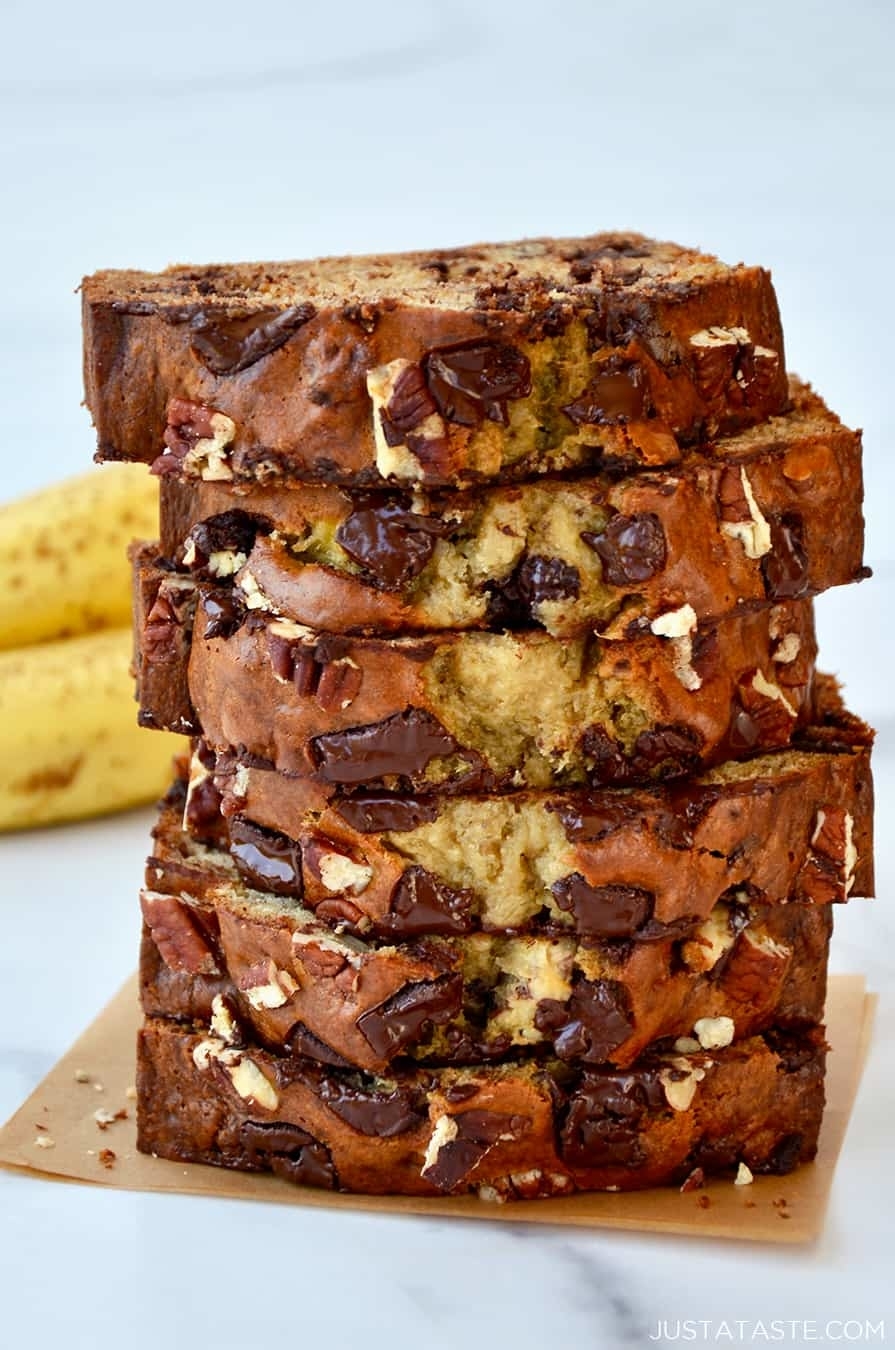 A stack of chocolate chip banana bread slices showcasing the moist texture and mix-ins