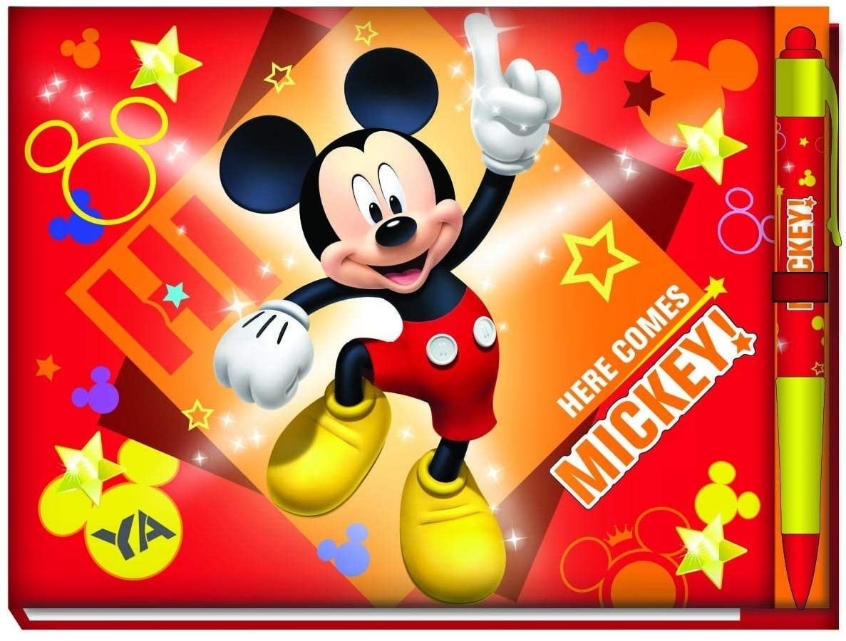 Mickey Mouse is posing with a thumbs up next to text &quot;Here Comes Mickey&quot; on a bright background