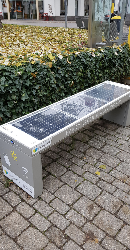 Solar panel bench for charging phones with USB ports