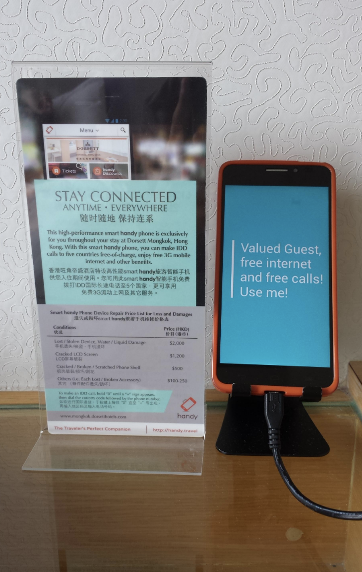 Hotel smartphone for free internet and calls charging on the stand