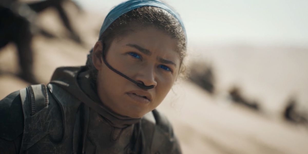 Elsa from Frozen looks concerned, wearing a headset and gear, in a desert setting