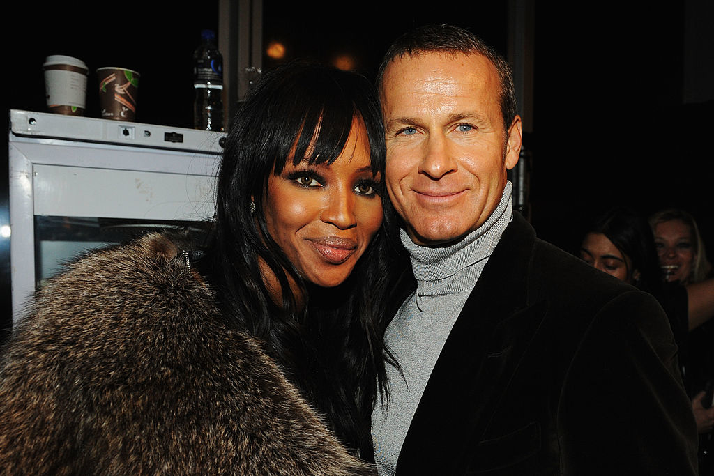 Naomi and Vladislav smiling close together, one in a furry outer garment and the other in a turtleneck
