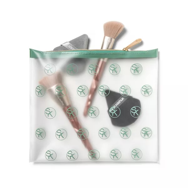 Transparent makeup bag containing brushes and a blender sponge