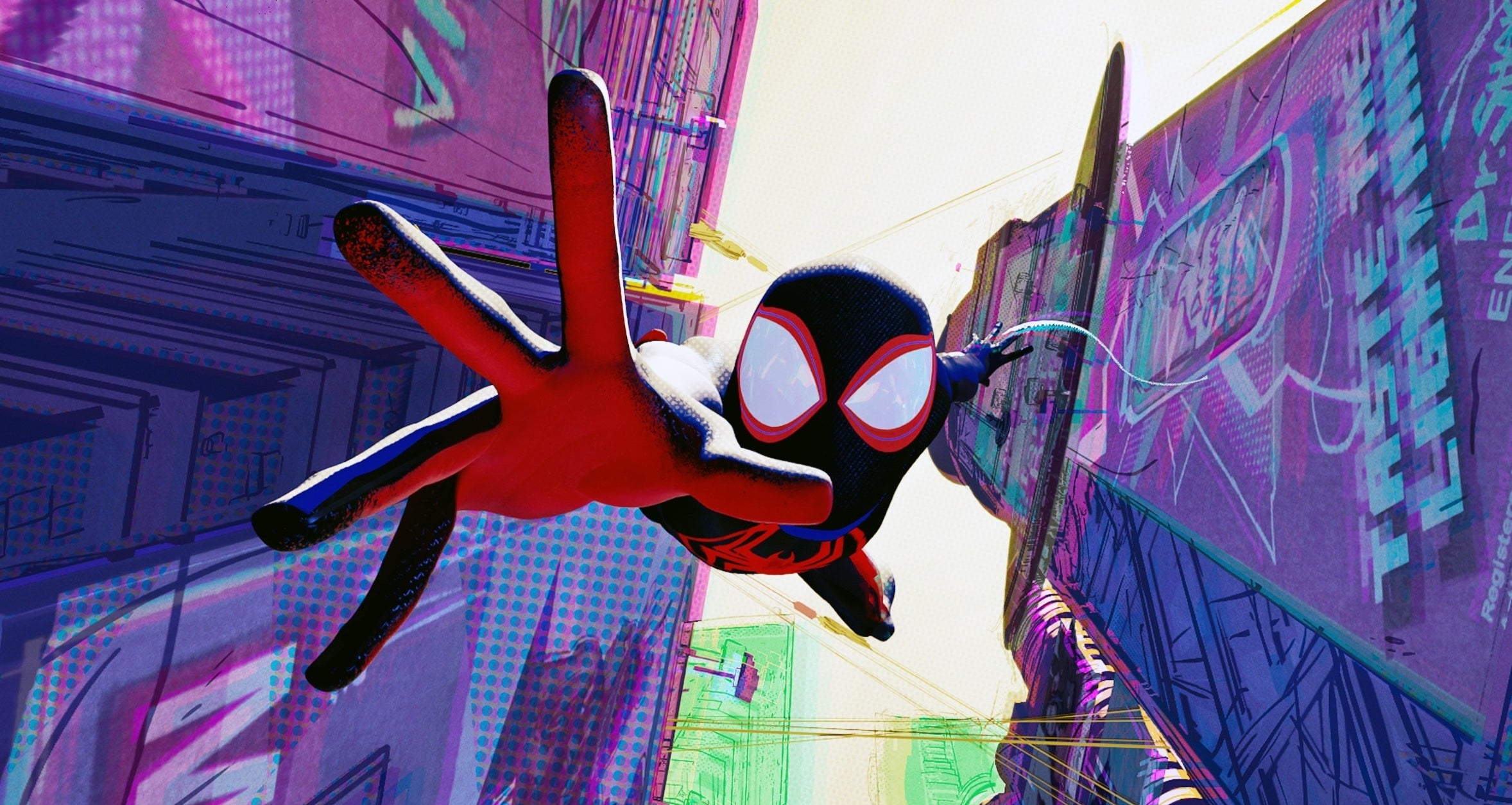 Miles Morales as Spider-Man swinging between buildings in &quot;Spider-Man: Across the Spider-Verse&quot;
