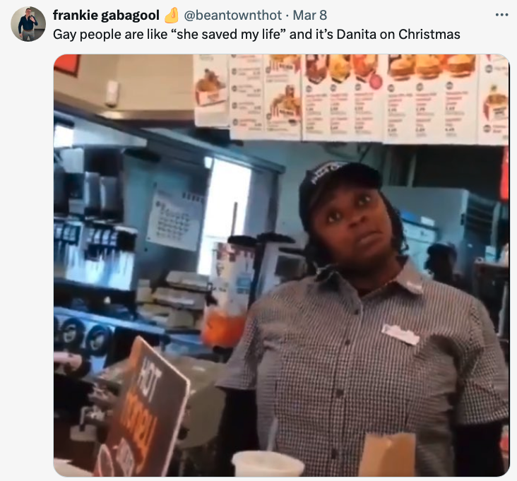 Fast food employee Danita at work with promotional signage; tweet references a humorous saying
