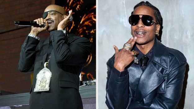 Two male artists, one performing with a microphone, the other wearing sunglasses and jewelry