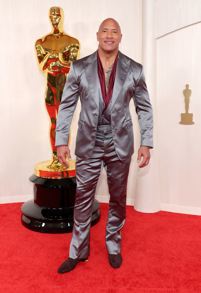 Dwayne Johnson wearing a shiny suit at an award show