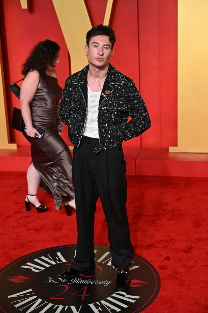 Barry in a patterned jacket and trousers posing on event carpet