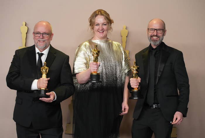 Nadia Stacey, Mark Coulier, and Josh Weston with the Academy Award for Best Hair and Makeup