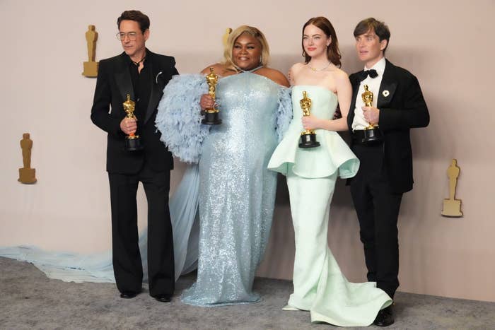Four Oscar winners posing with their awards: RDJ and Cillian Murphy on the ends, Da&#x27;Vine Joy Randolph and Emma Stone in the center
