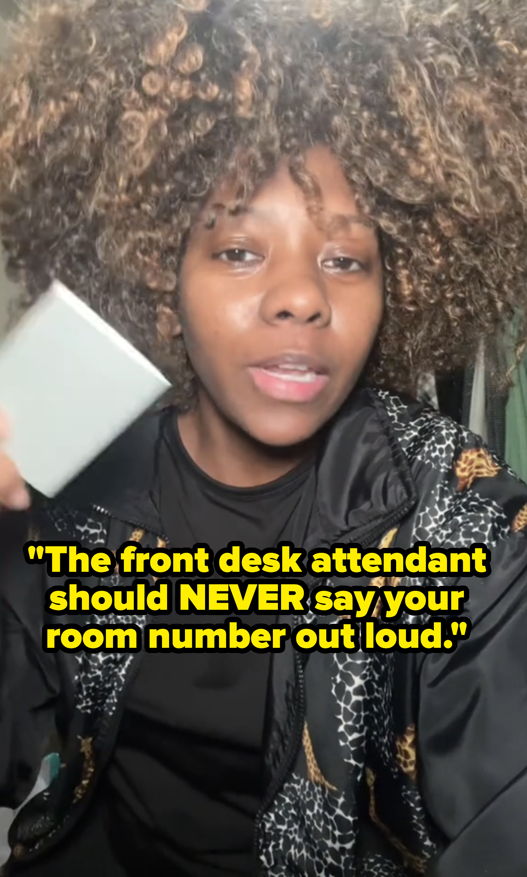 Patrice continues talking in the video with the text: &quot;The front desk attendant should never say your room number out loud&quot;