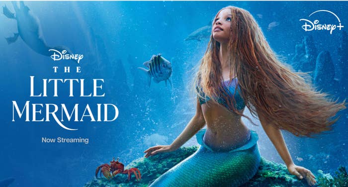 Promotional image for Disney&#x27;s &quot;The Little Mermaid&quot; featuring Ariel with sea creatures, advertising now streaming on Disney+