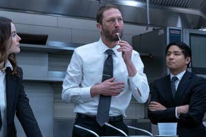Ebon Moss-Bachrach tasting something in a kitchen as Richie on The Bear