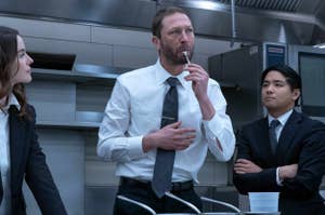 Ebon Moss-Bachrach tasting something in a kitchen as Richie on The Bear