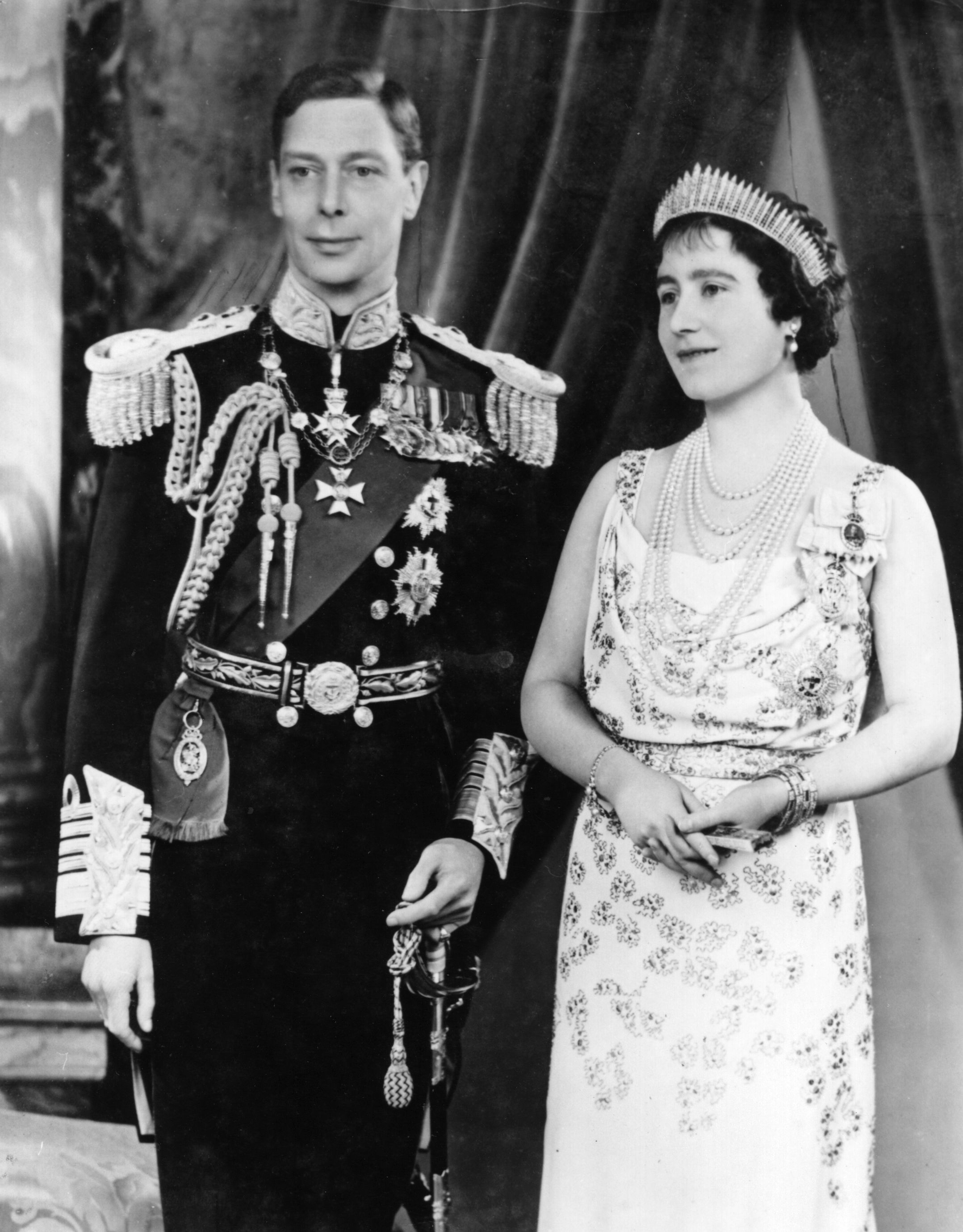King George VI in military attire and Queen Elizabeth (the Queen Mother) in a formal dress with a tiara