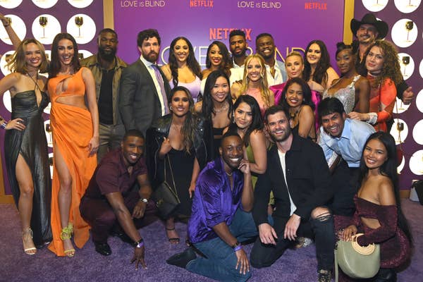Group of  quot;Love is Blind quot; reality show cast members posing together at a Netflix event