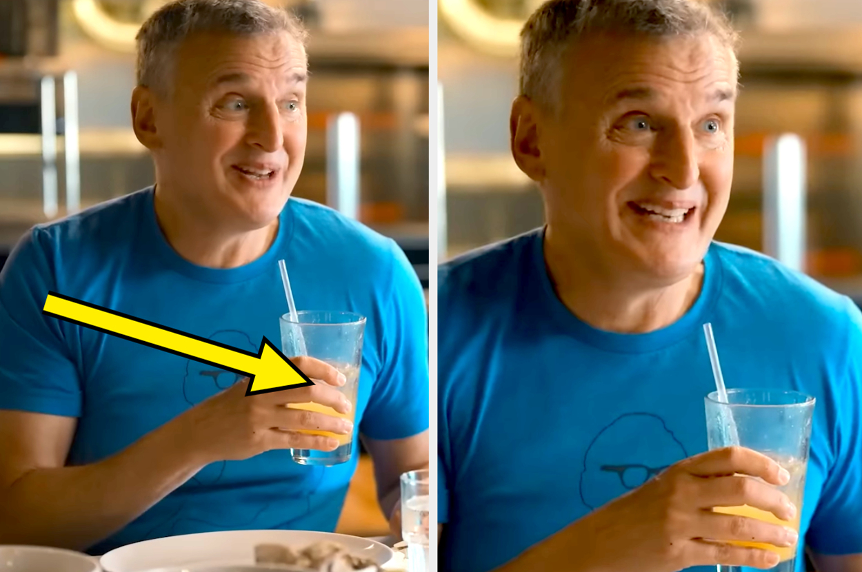 Phil Rosenthail holding a drink and smiling