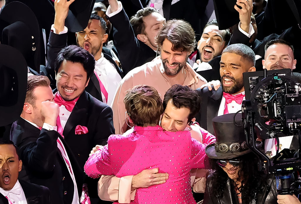 Ryan Gosling and Mark Ronson embracing onstage at the Oscars