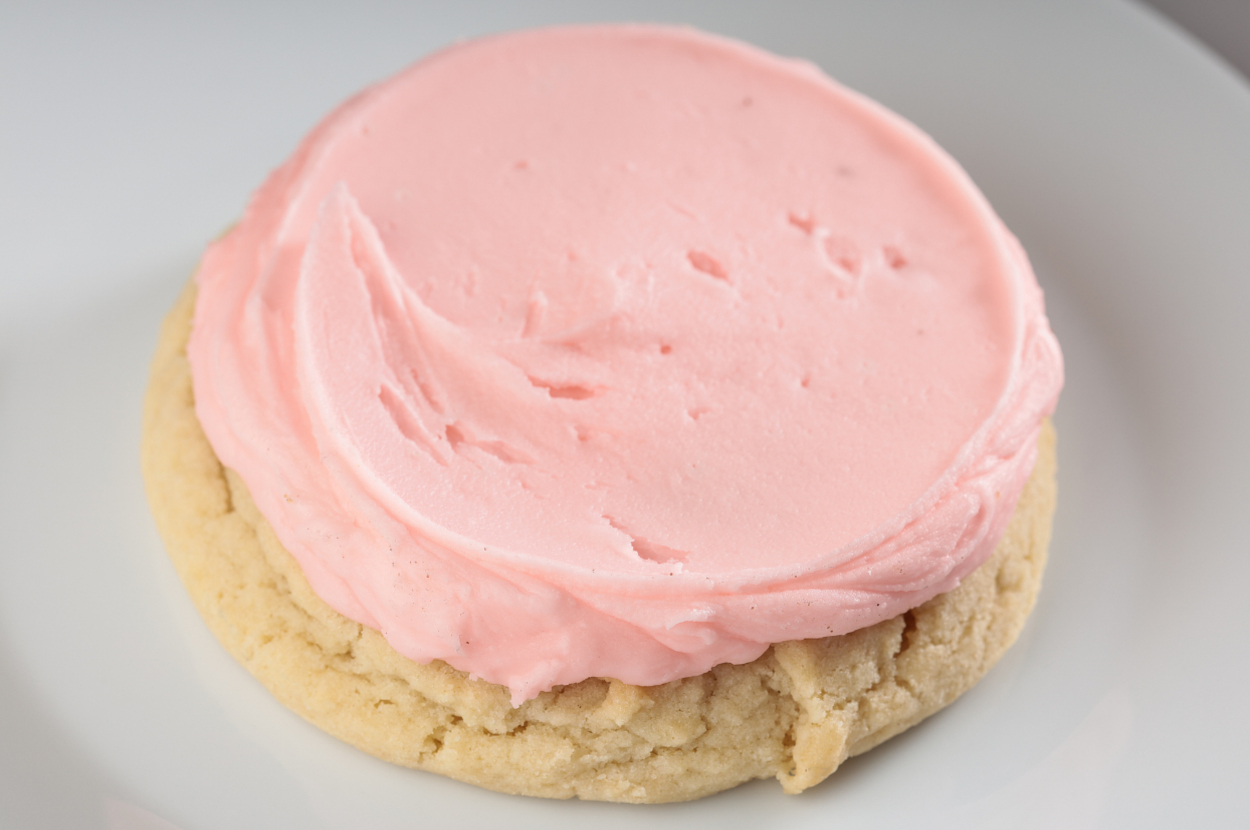 Frosted sugar cookie on a plate