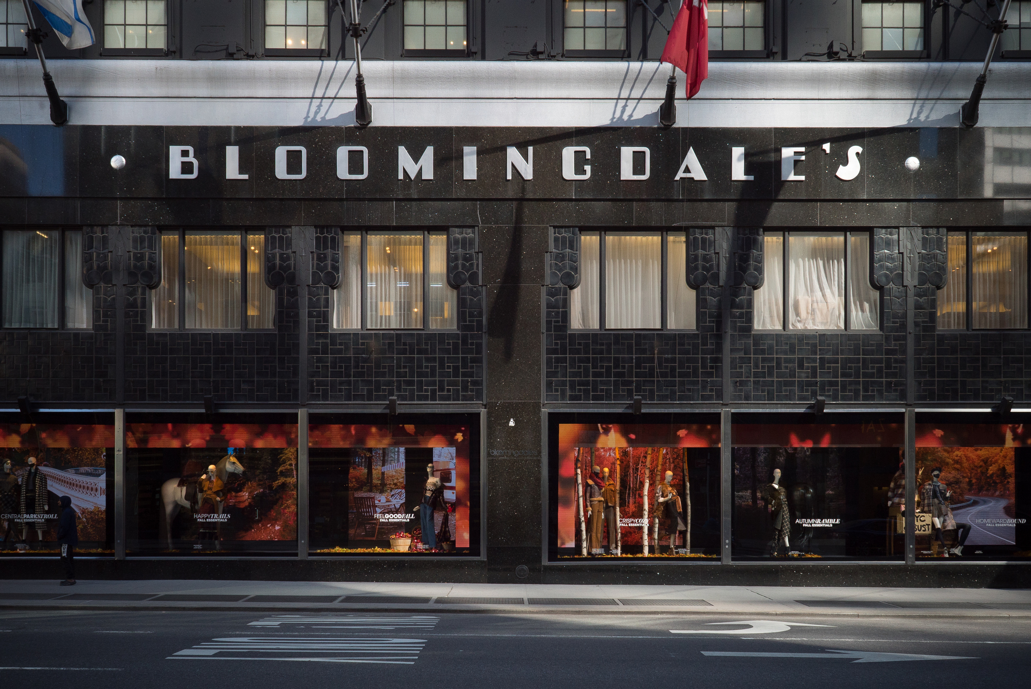 Exterior view of Bloomingdale&#x27;s department store with display windows and flags above