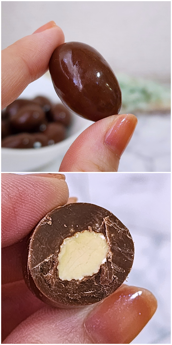 手に持ったチョコレートアーモンド、上は全体、下は半分に割った断面。