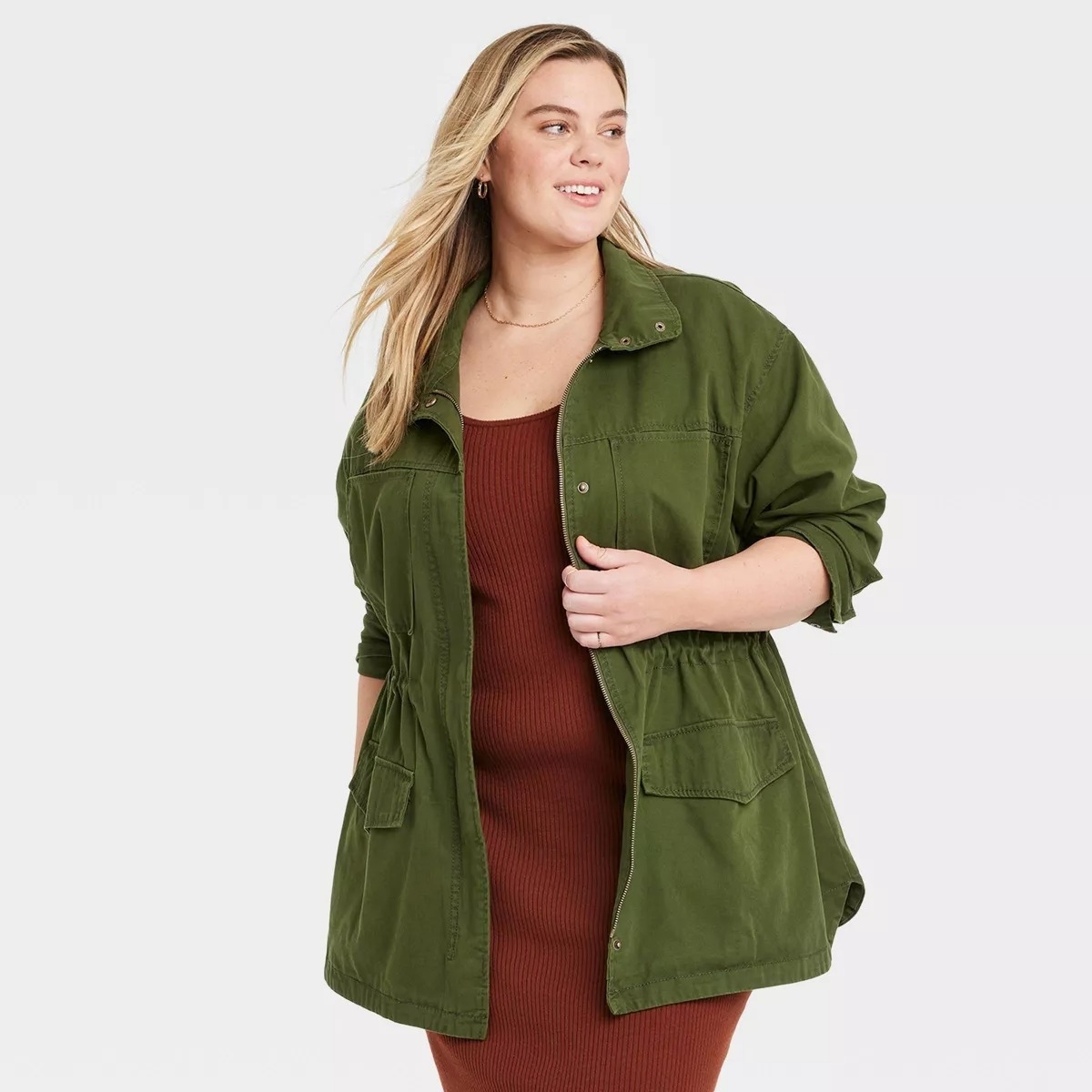 Model in anolive green field jacket