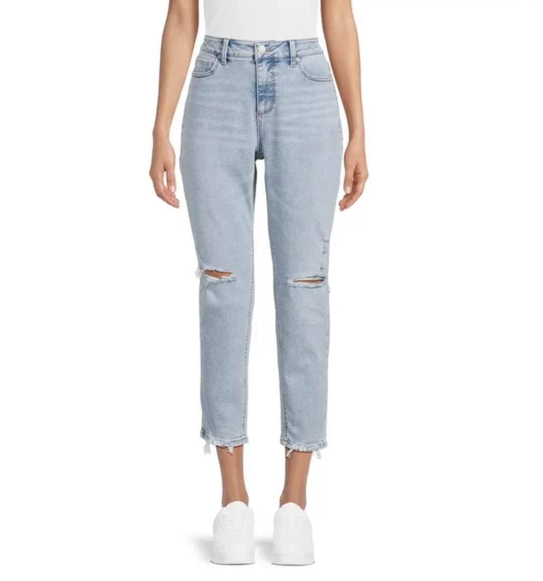 A pair of cropped distressed light wash jeans