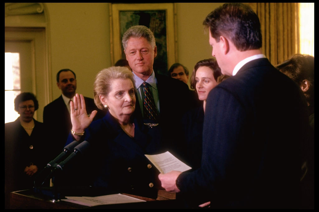 State Secy. Madeleine Albright (L) raising hand, being sworn-in by VP Al Gore