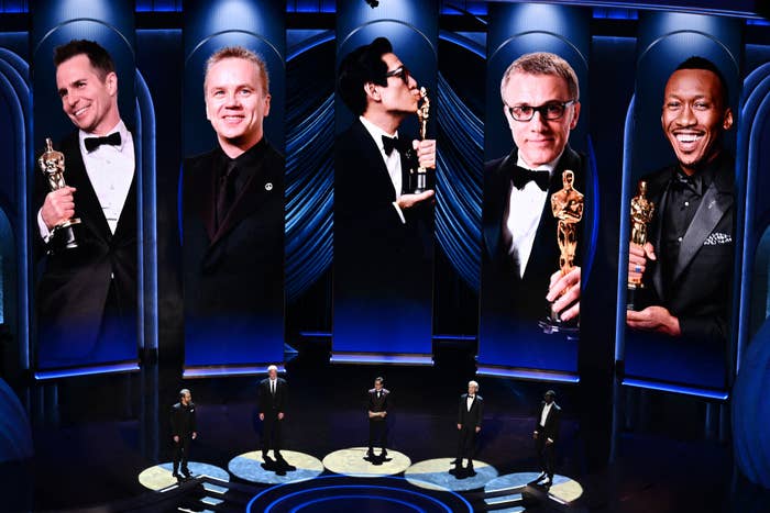 Sam Rockwell, Tim Robbins, Christoph Waltz, Mahershala Ali, and Ke Huy Quan on stage at the Oscars