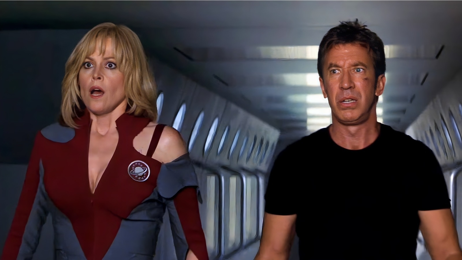 Two characters from the TV show Galaxy Quest, Gwen DeMarco and Jason Nesmith, looking surprised