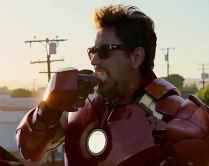 Tony Stark in Iron Man suit without helmet, eating