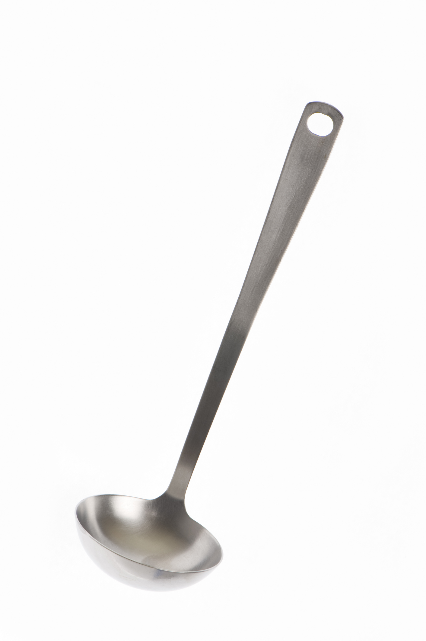 Metal ladle against a plain background