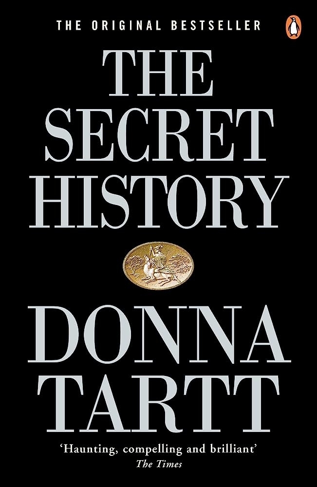 Cover of &quot;The Secret History&quot; by Donna Tartt, featuring title and author&#x27;s name with a small central illustration
