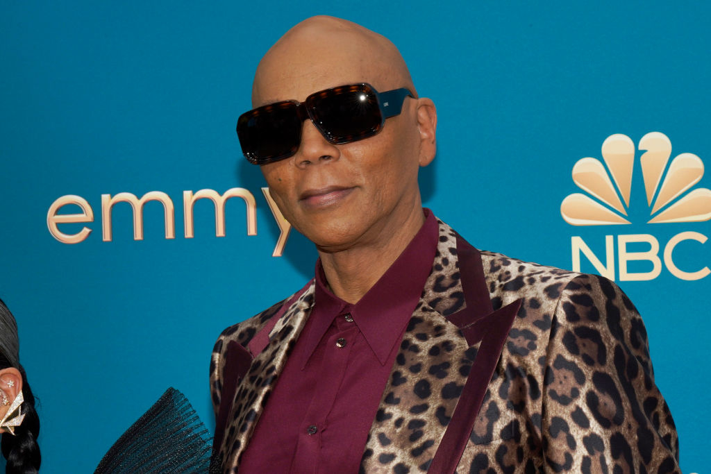 RuPaul in a leopard-print jacket posing at the Emmy Awards