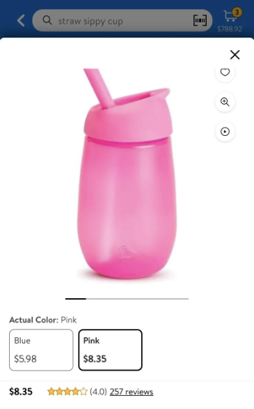 Product image of a pink straw sippy cup with lid against a white background