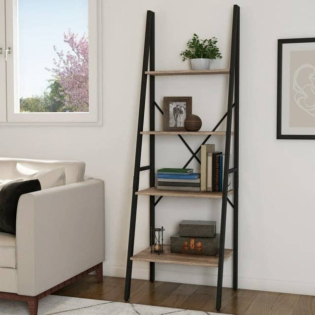 A-frame ladder shelf with various decorative items and books in a living room setting