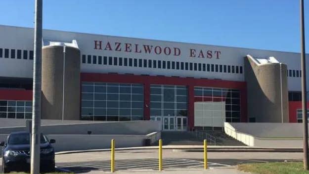 Exterior view of Hazelwood East High School with a clear sky in the background