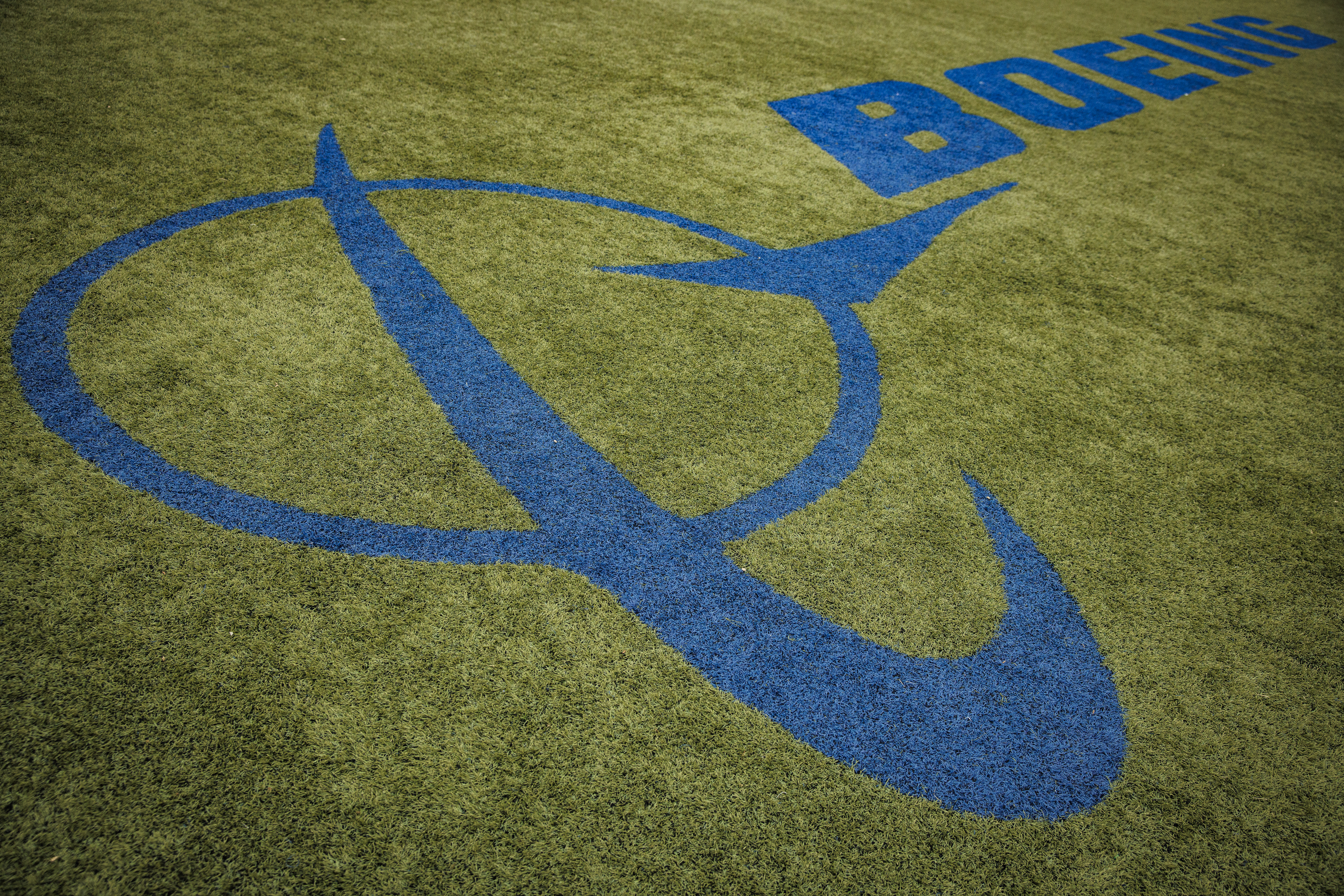 Boeing logo painted on grassy surface