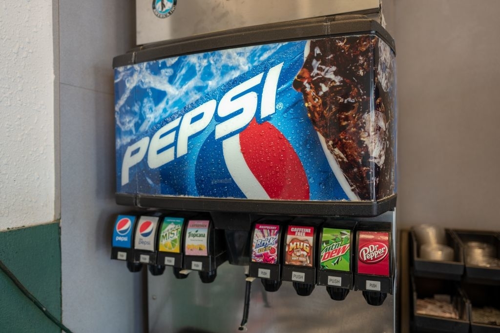 A Pepsi fountain drink machine with multiple soda options available