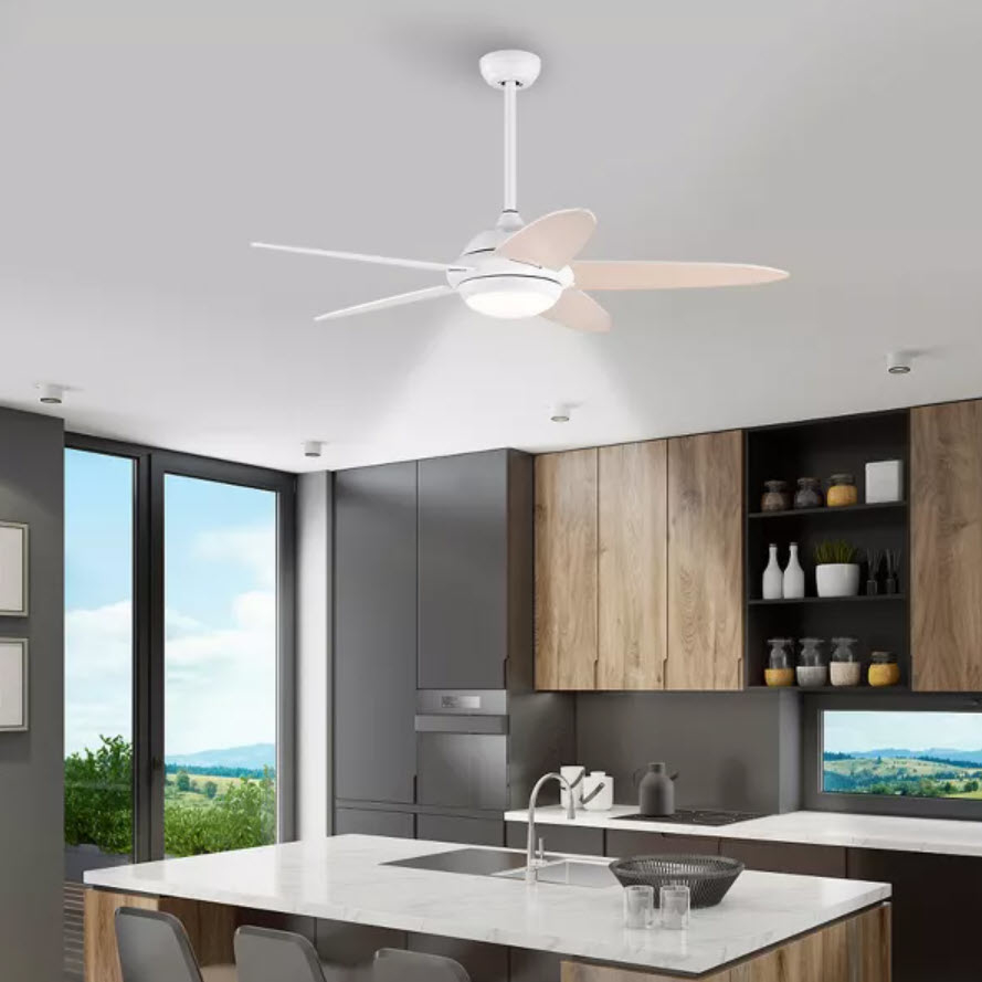 Modern kitchen interior with a ceiling fan above an island. No persons are visible