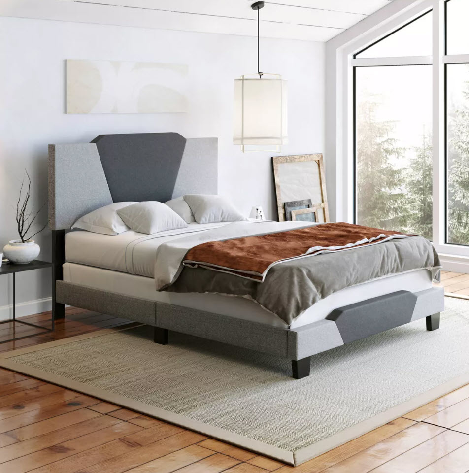 Modern bedroom with a neatly made bed, two nightstands, and a large window