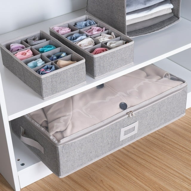 Drawer organizers with various compartments holding socks and underwear, under-bed storage bin with lid