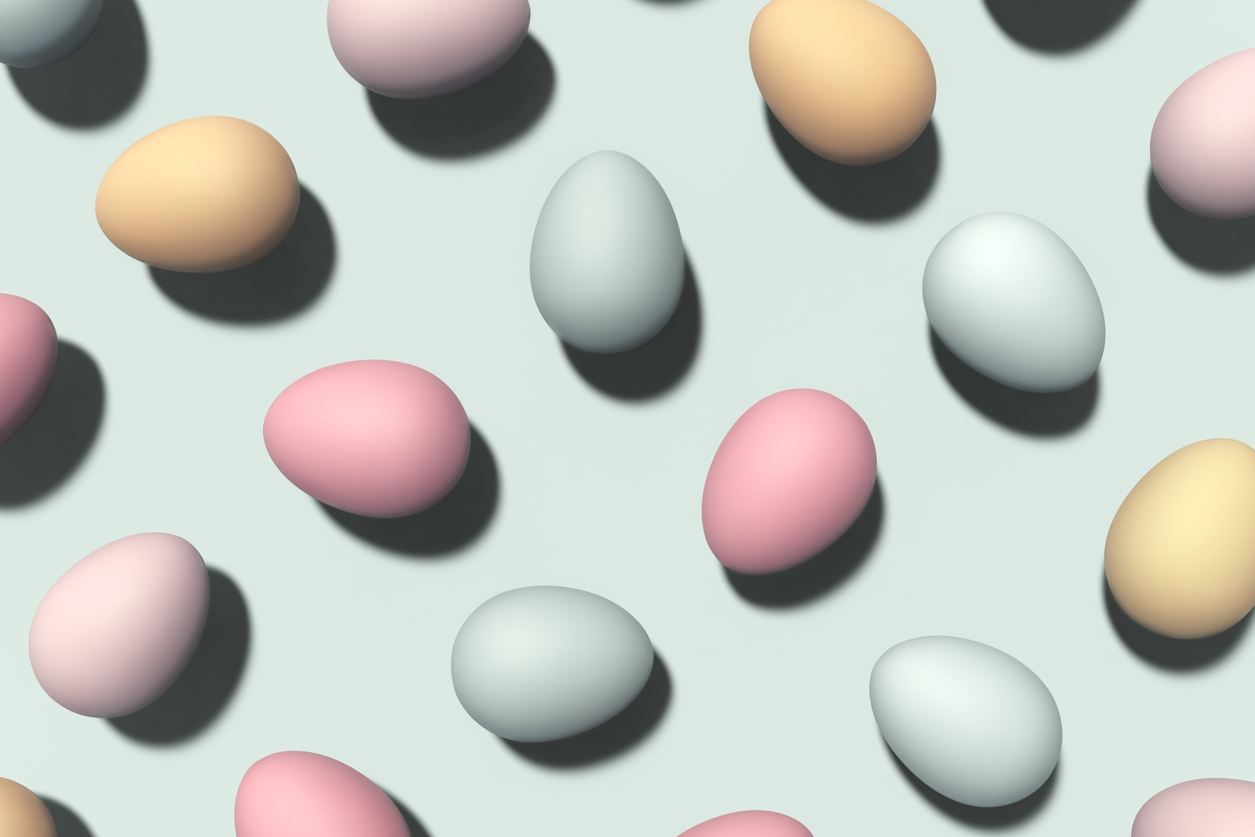 Image of several 3D-rendered eggs on a flat surface, in varying pastel tones